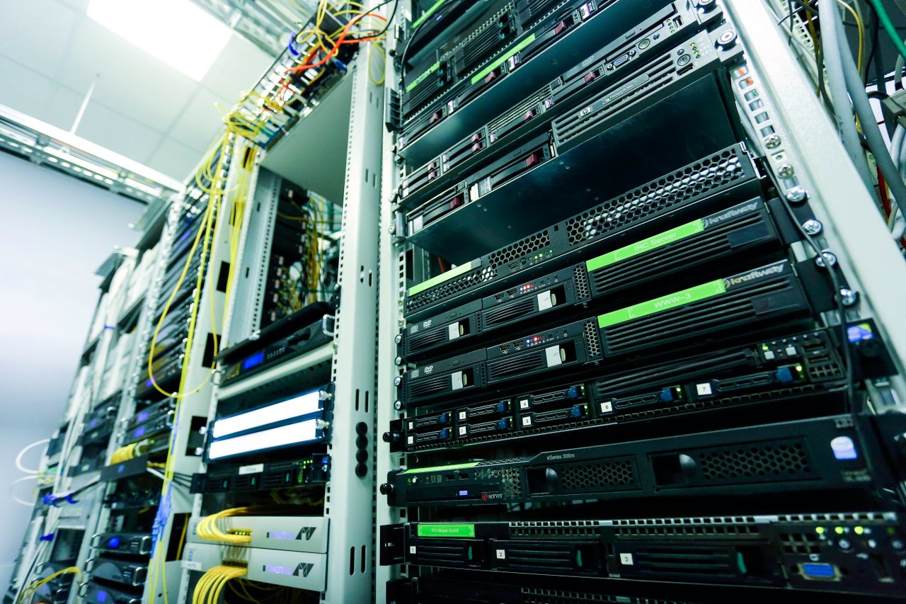Mastering the First Impression: Your intriguing post title goes here High-tech server rack in a secure data center with network cables and hardware components.